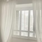 Pair Plantation Shutters with Curtains