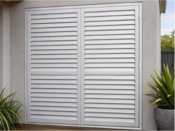 Coastal residential home with aluminum plantation shutters