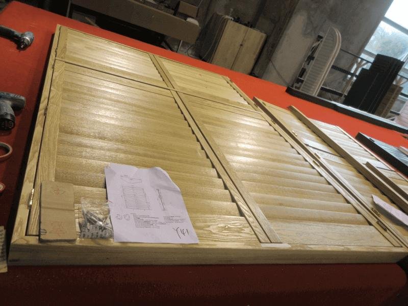 Ash wood plantation shutters showing visible grain character