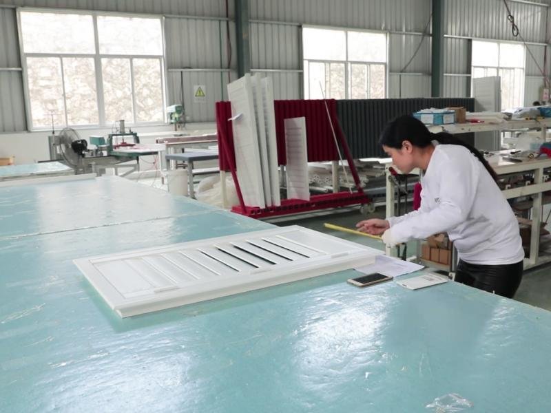 Factory assembly line producing window coverings to OEM specifications