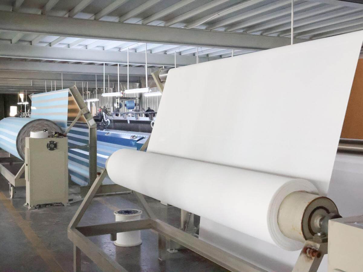 Goodwood Shutters window shade production line -- automated cutting and sealing