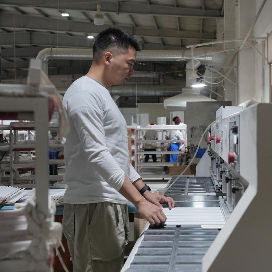 CNC machining centre processing wood panels for plantation shutters