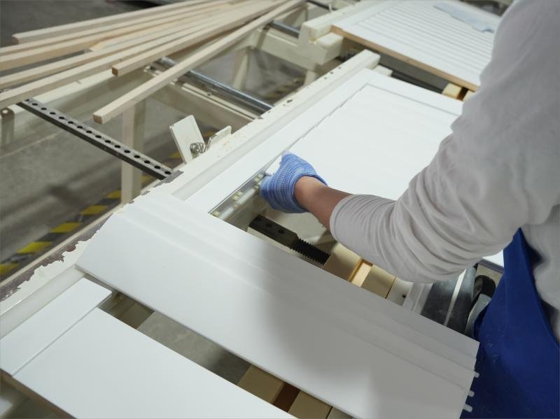 Assembly of wood plantation shutter panels at automated workstations