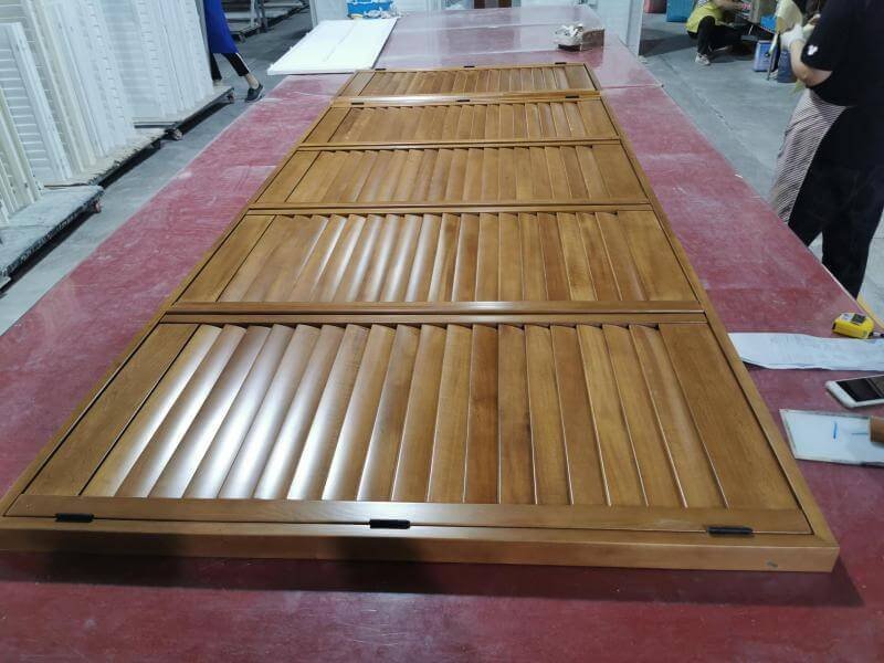 Warehouse with packaged plantation shutter boxes on racking