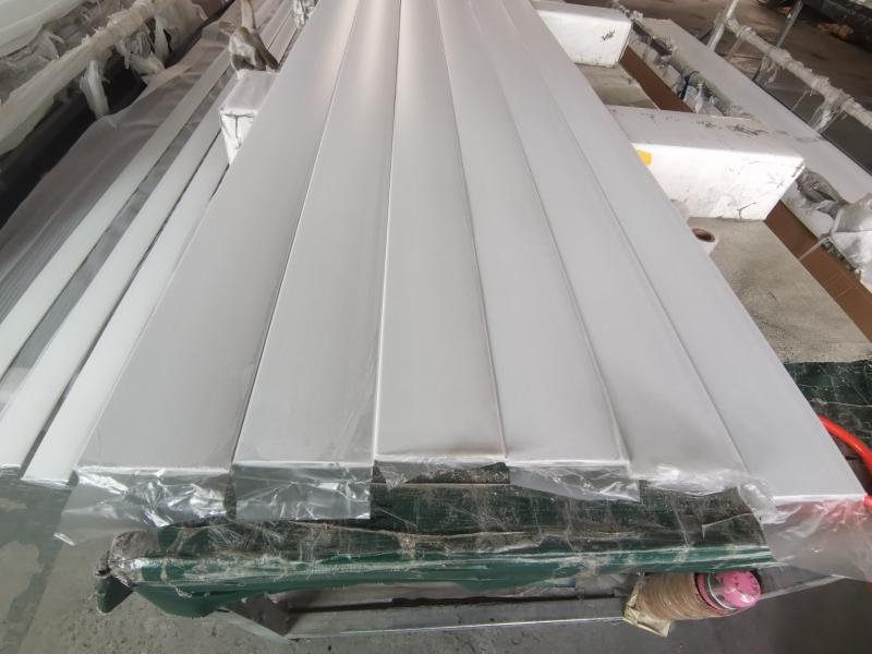 Stacked louvre blades and shutter frame components ready for export